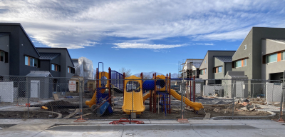 Image of a playground surrounded by homes.